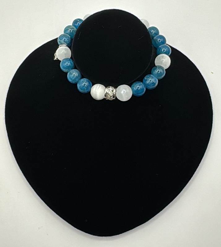 Manifestation Bracelet with blue apatite and white selenite beads on black display stand