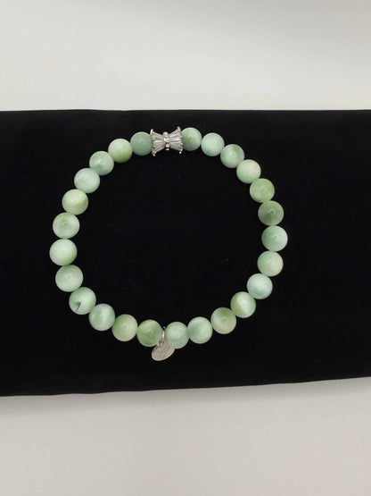 Seafoam Serenity Green Larimar Bracelet with polished green beads and elegant charm in soft ocean tones
