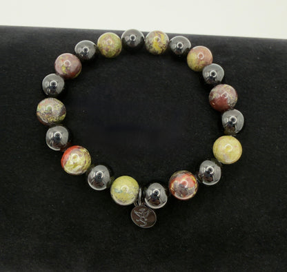 Black Tourmaline and Bloodstone protection bracelet with silver angel charm on a wrist