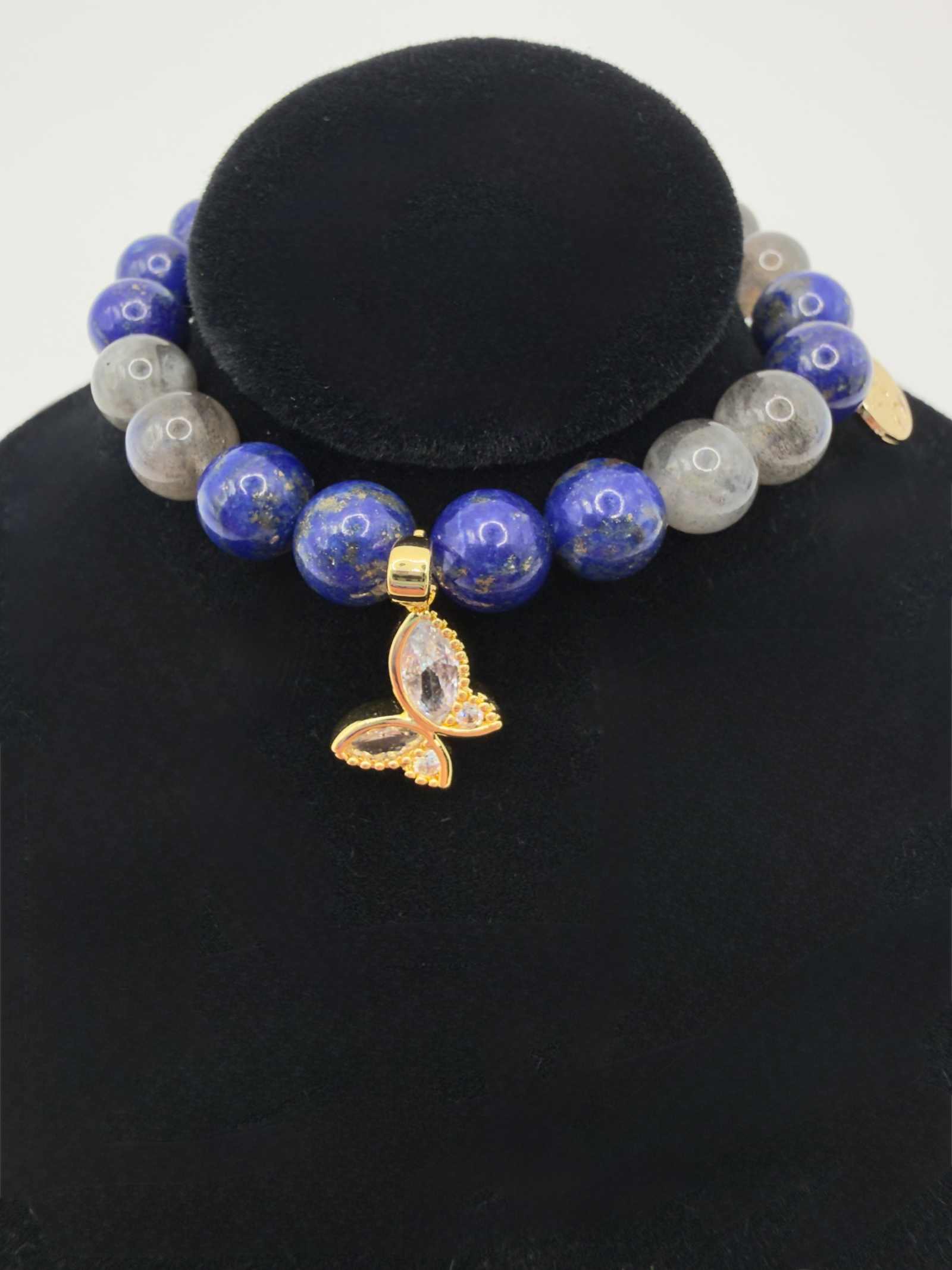 Lapis Lazuli and Labradorite bracelet with gold butterfly charm, deep blue and iridescent beads on stretch cord