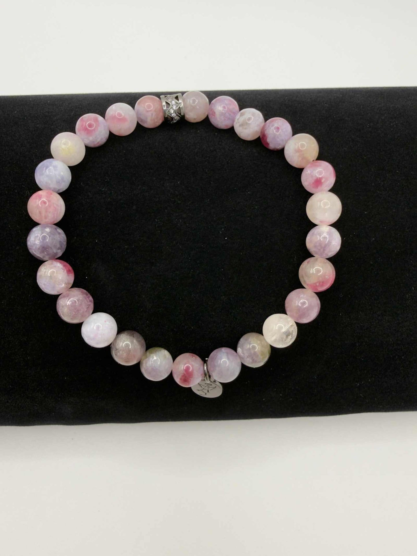 Mystic Harmony Unicorn Stone Bracelet with pink, purple, and earthy beads featuring an elegant accent bead.