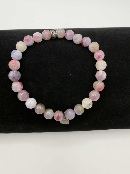 Mystic Harmony Unicorn Stone Bracelet with pink, purple, and earthy beads featuring an elegant accent bead.