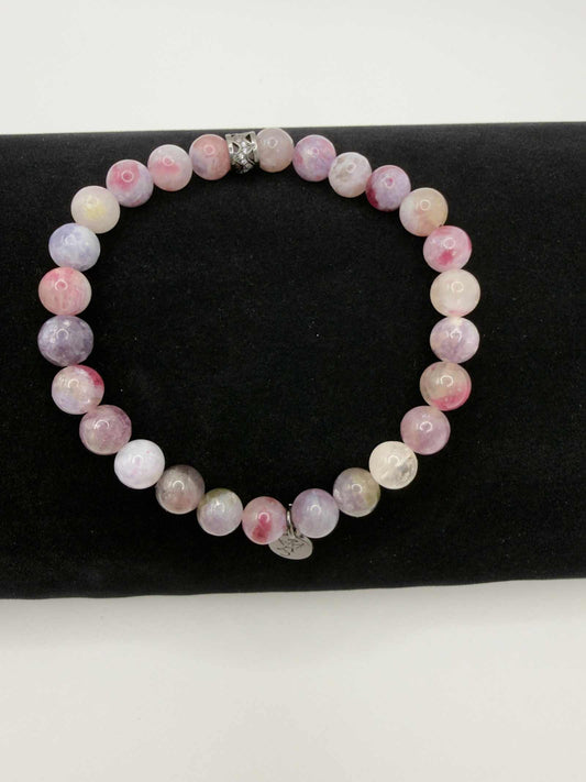 Mystic Harmony Unicorn Stone Bracelet with pink, purple, and earthy beads featuring an elegant accent bead.