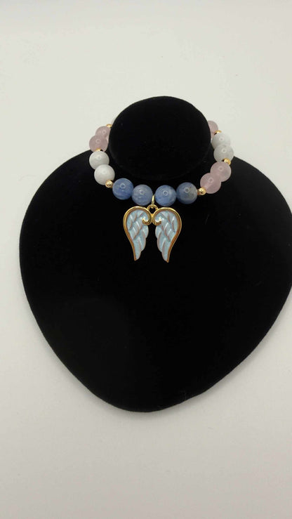 Blue kyanite, moonstone, and rose quartz grief bracelet with angel wings charm for emotional healing