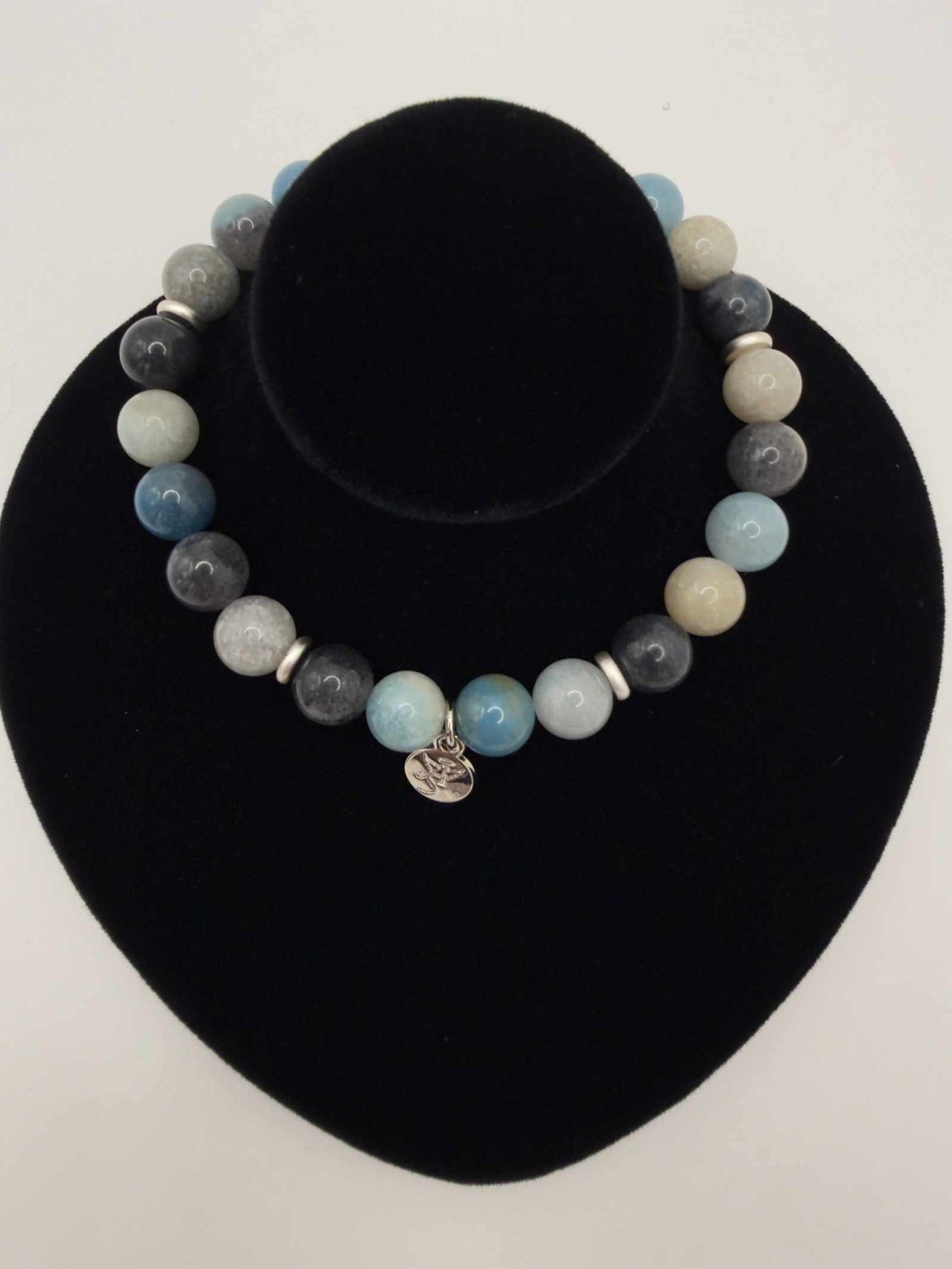 Tranquil Awakening Trolleite Bracelet with soft blue polished beads and elegant accent bead for calming, everyday wear