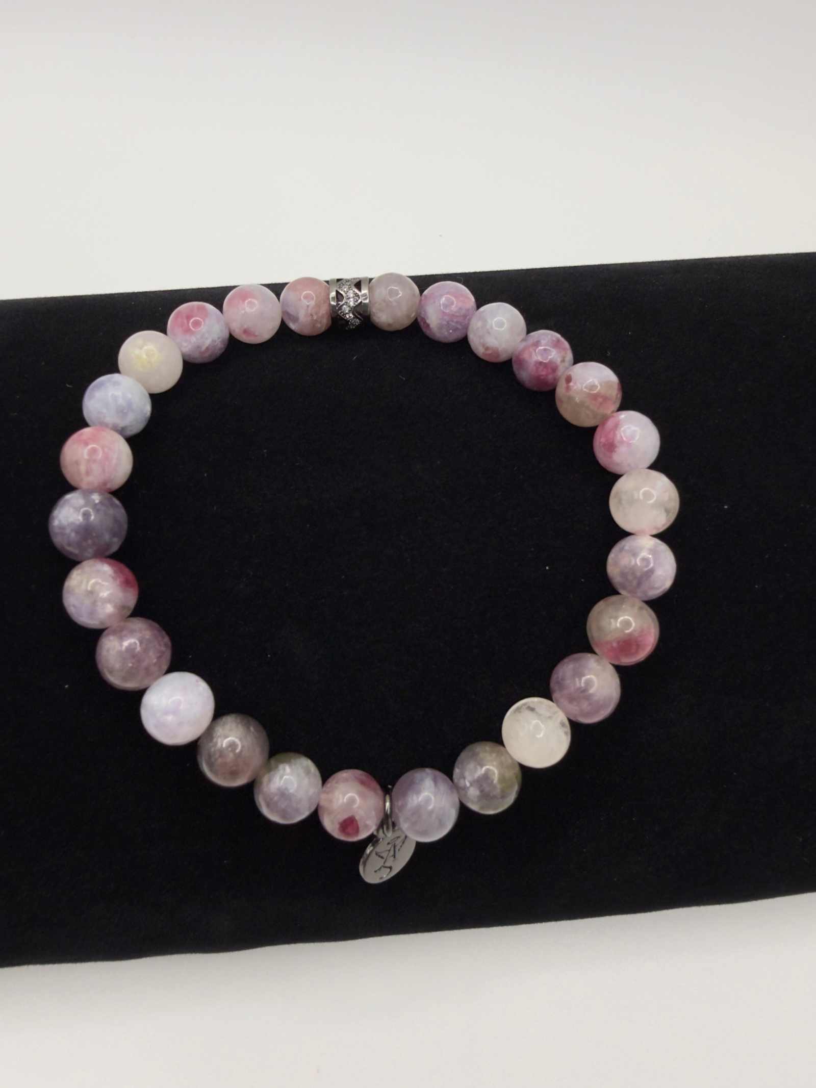 Mystic Harmony Unicorn Stone Bracelet with pink, purple, and earthy beads and elegant accent