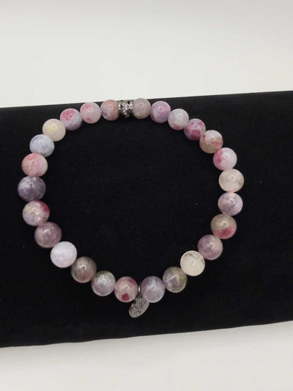 Mystic Harmony Unicorn Stone Bracelet with pink, purple, and earthy beads and elegant accent