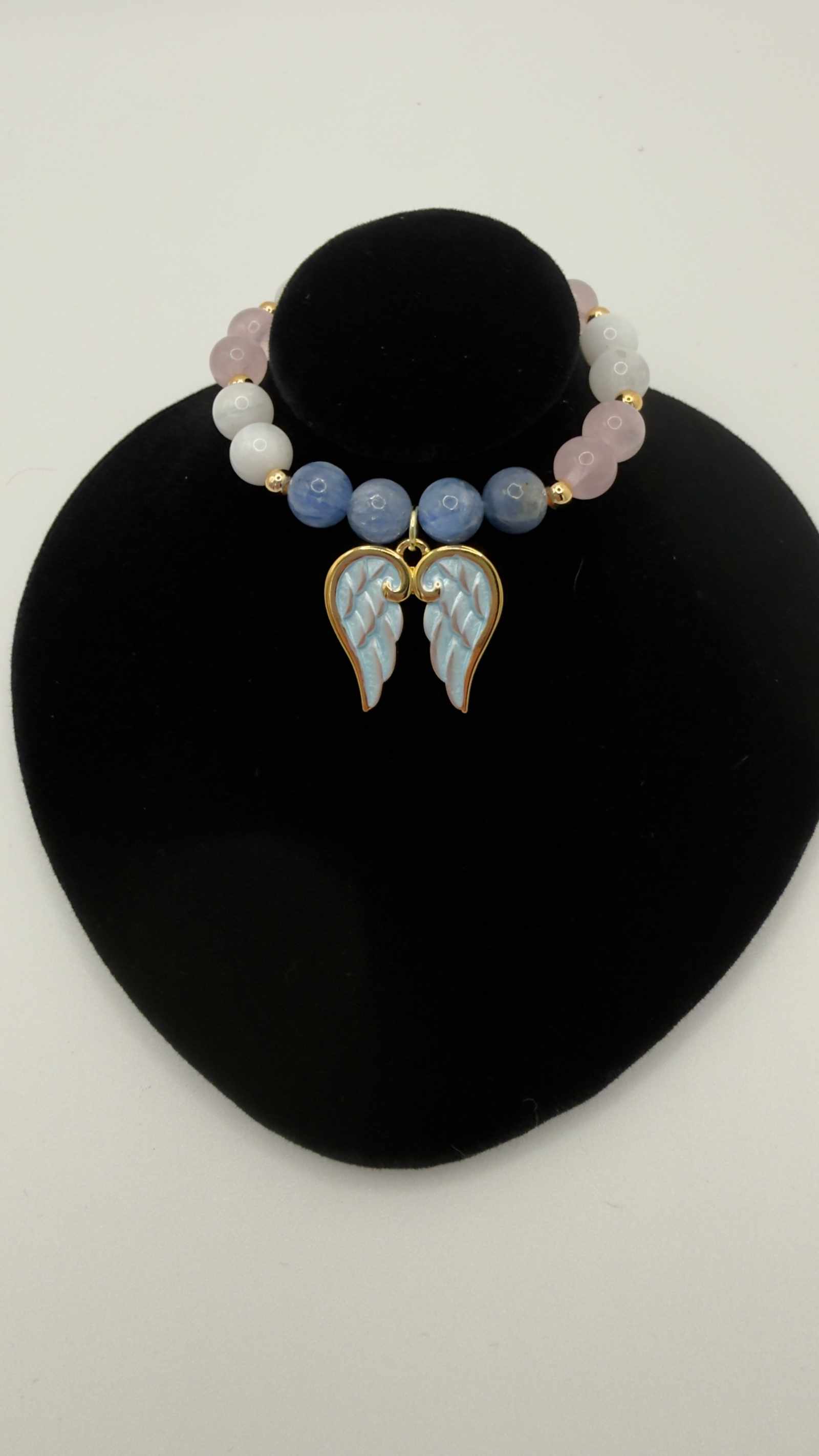 Blue kyanite, moonstone, and rose quartz grief bracelet with optional angel wings charm on stretch cord