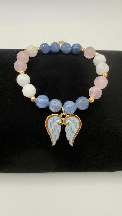 Blue kyanite, moonstone, and rose quartz grief bracelet with optional angel wings charm, handcrafted for emotional healing and comfort