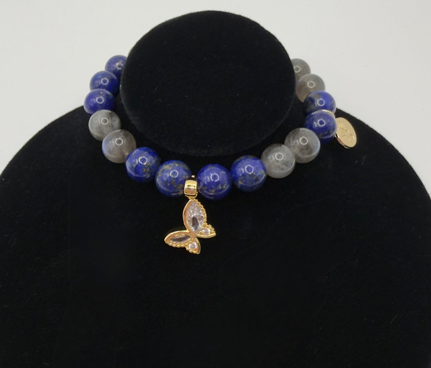 Lapis Lazuli and Labradorite bracelet with butterfly charm featuring deep blue and iridescent beads on stretch cord