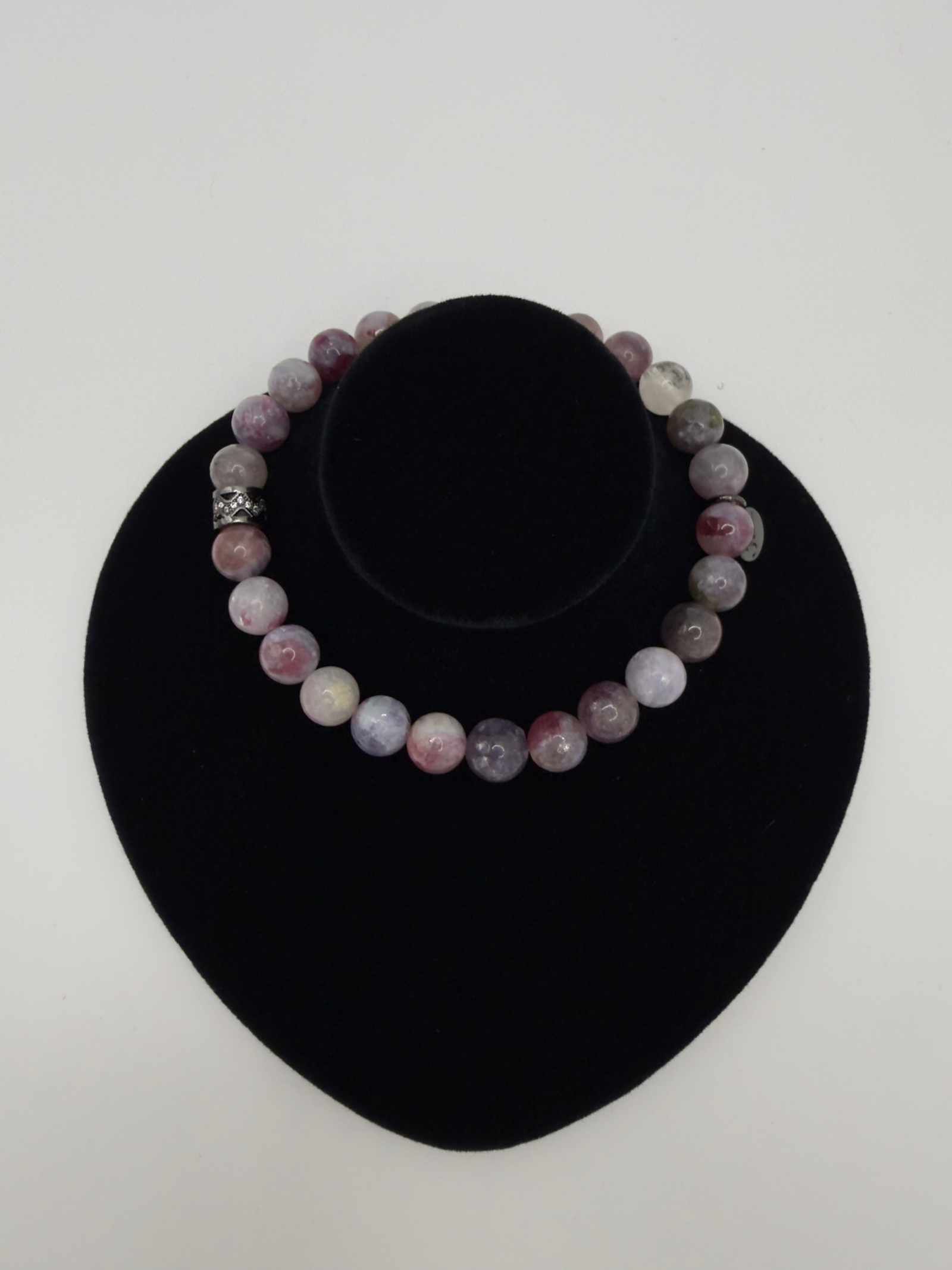 Mystic Harmony Unicorn Stone Bracelet with pink, purple, and earthy beads and elegant accent stone