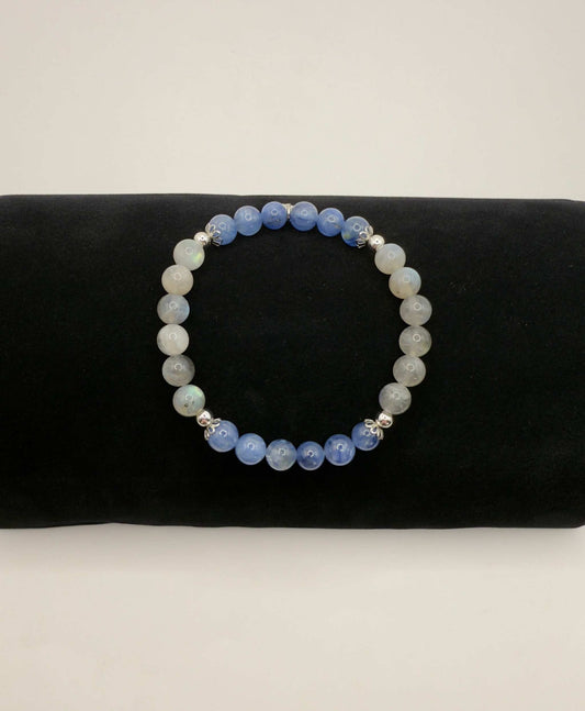 Awakening Light Bracelet with kyanite and labradorite beads on black display pillow