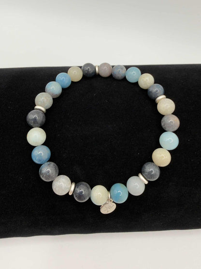 Tranquil Awakening Trolleite Bracelet with soft blue marbled beads and accent bead, smooth polished finish, designed for comfort and calm awareness