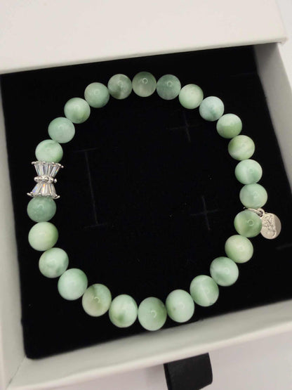 Seafoam Serenity Green Larimar Bracelet with polished green beads and elegant charm on wrist