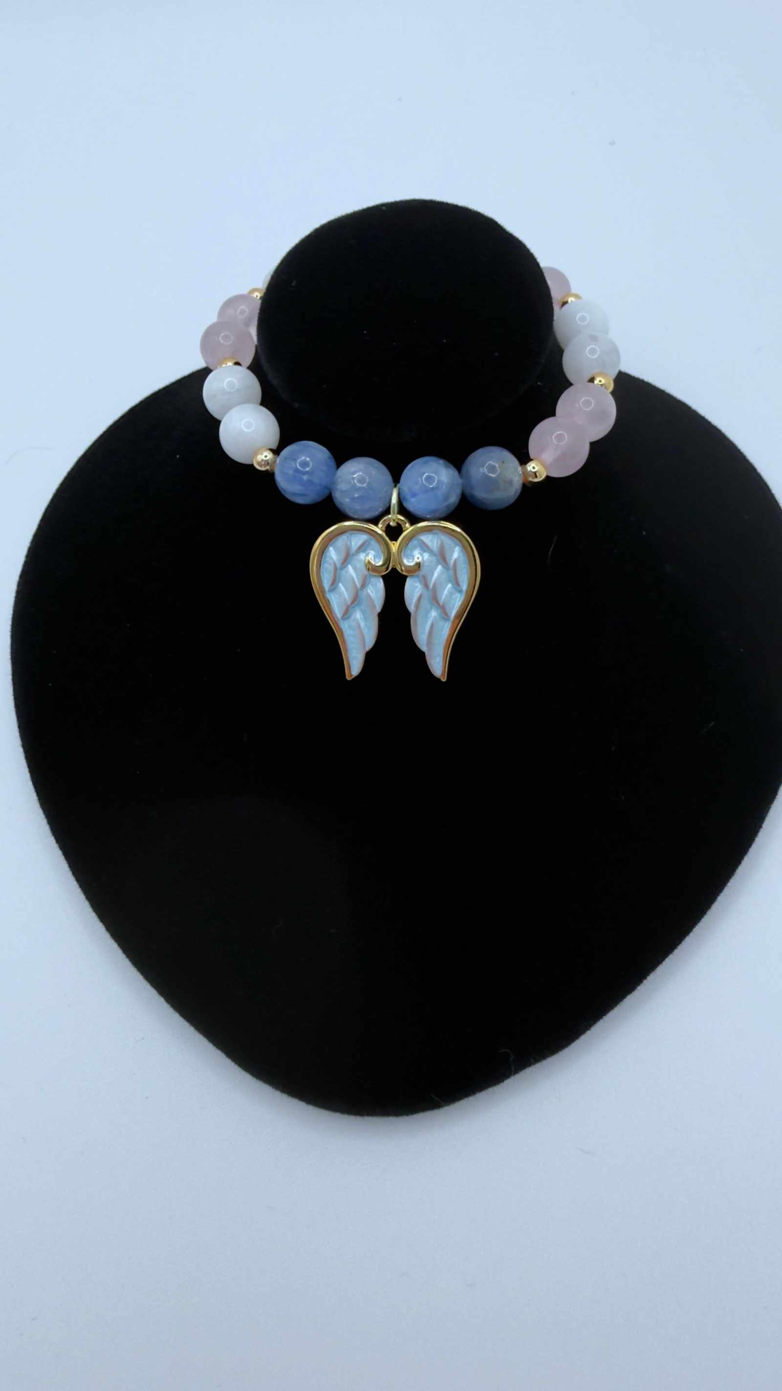 Handcrafted grief bracelet with blue kyanite, moonstone, rose quartz beads and optional angel wings charm for emotional healing and comfort