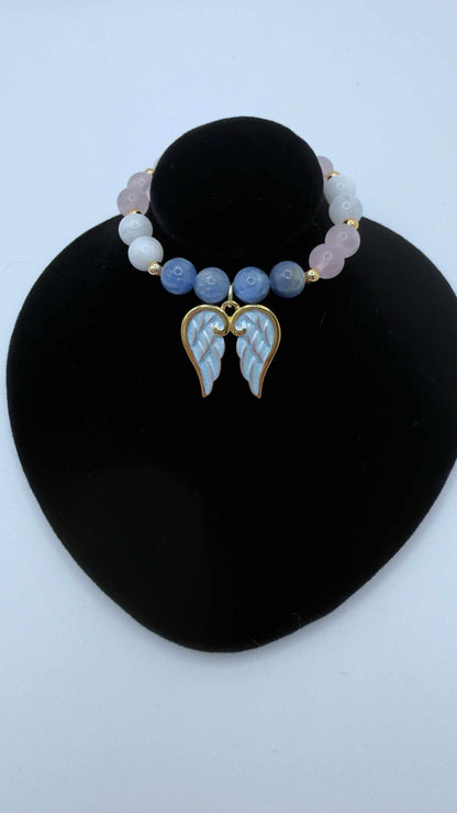 Handcrafted grief bracelet with blue kyanite, moonstone, rose quartz beads and optional angel wings charm for emotional healing and comfort