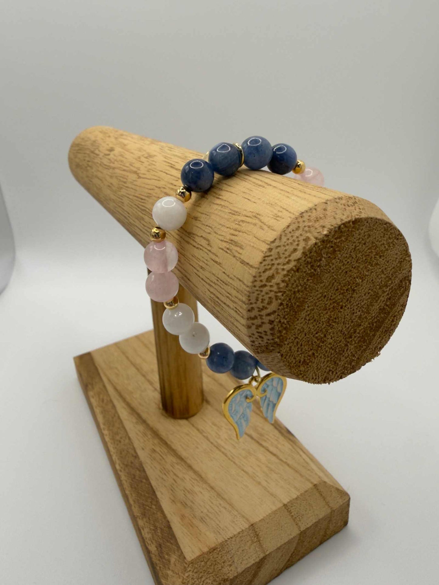 Handmade grief bracelet with blue kyanite, moonstone, and rose quartz beads for emotional healing and support