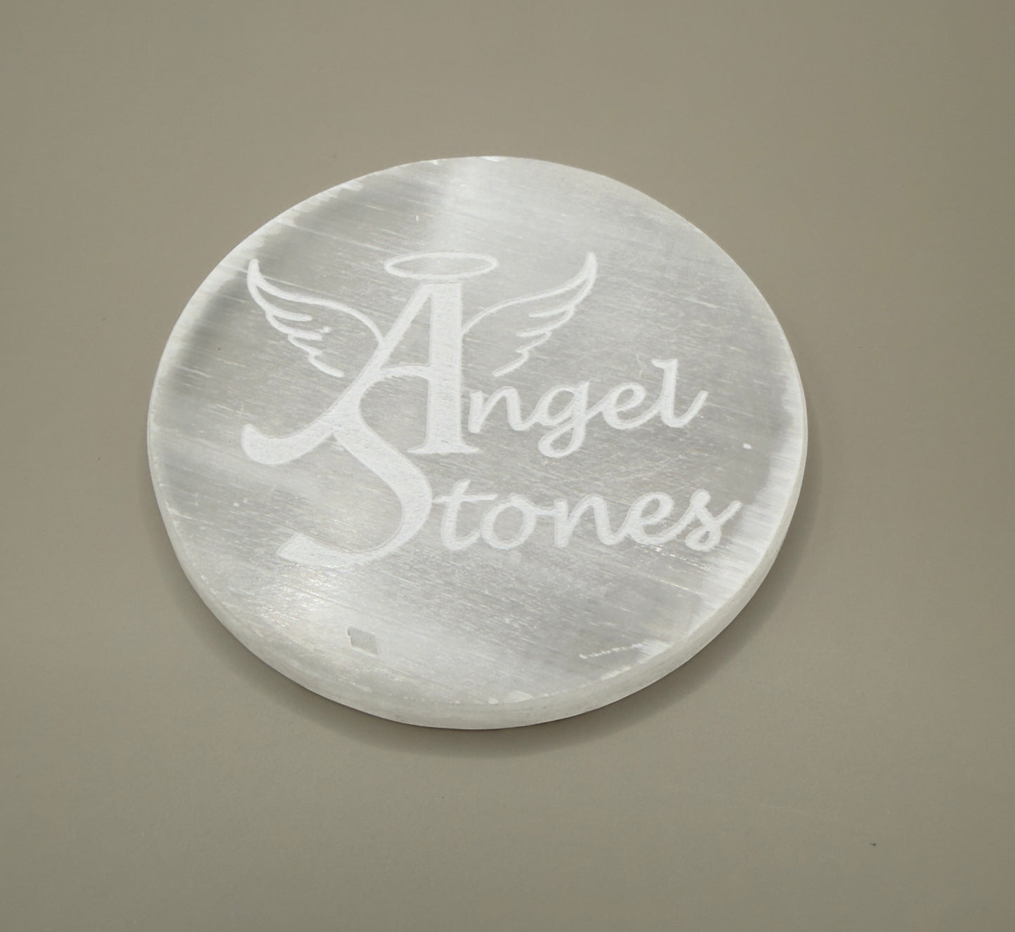 Angel Stones selenite charging plate with engraved wings and halo design for crystal cleansing and recharging