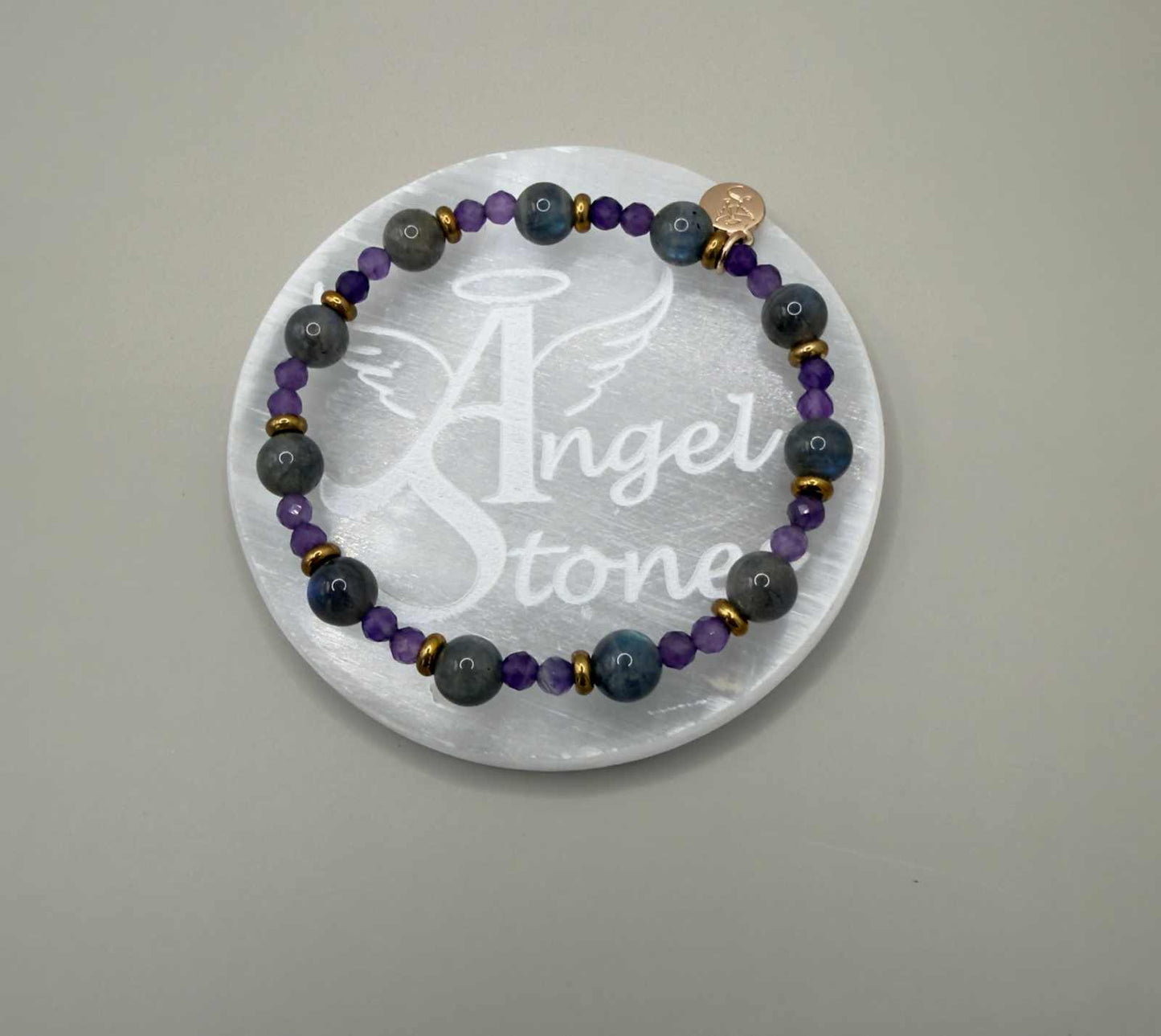 Angel Stones selenite charging plate with engraved wings and halo design for cleansing crystals and jewelry
