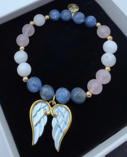 Handcrafted blue kyanite, moonstone, and rose quartz grief bracelet with optional angel wings charm for emotional healing and support