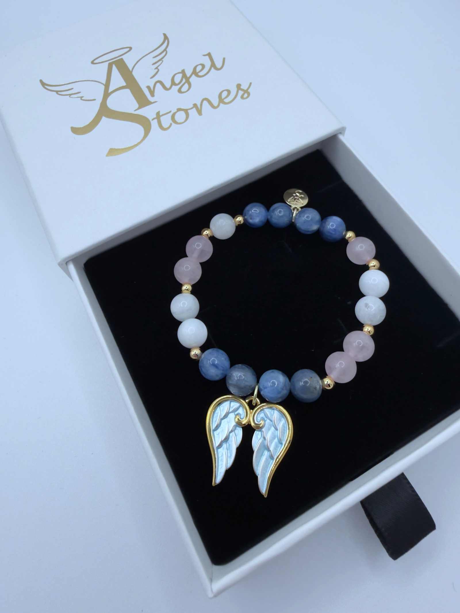 Handcrafted grief bracelet with blue kyanite, moonstone, rose quartz beads, and optional angel wings charm for emotional healing