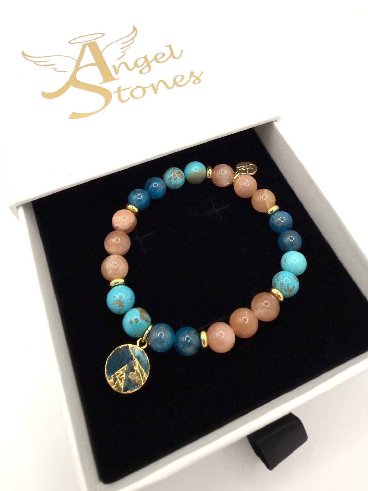 Ocean of Possibilities Bracelet featuring natural 8mm apatite, sunstone, and turquoise gemstone beads on a stretch cord with optional charm
