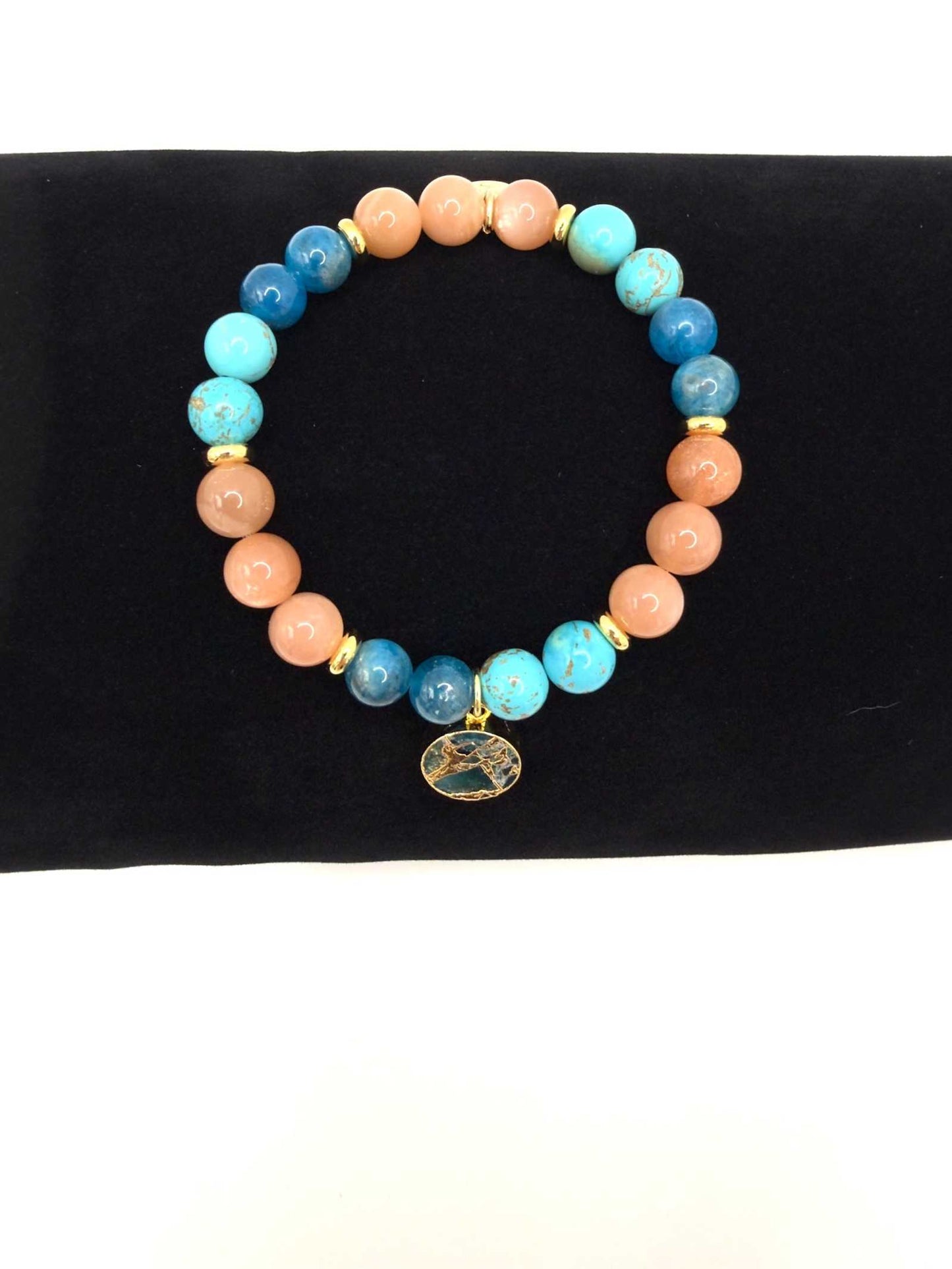 Ocean of Possibilities Bracelet with 8mm apatite, sunstone, and turquoise beads on stretch cord