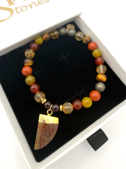 The Warrior Bracelet featuring Citrine, Garnet, Carnelian, Red Jasper, Tiger Eye, Fire Agate, Pyrite, and optional Jasper tusk charm
