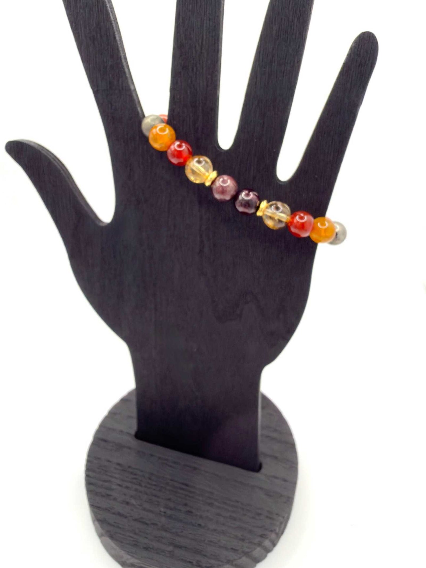 The Warrior Bracelet featuring Citrine, Garnet, Carnelian, Red Jasper, Tiger Eye, Fire Agate, Pyrite, and optional Jasper tusk charm