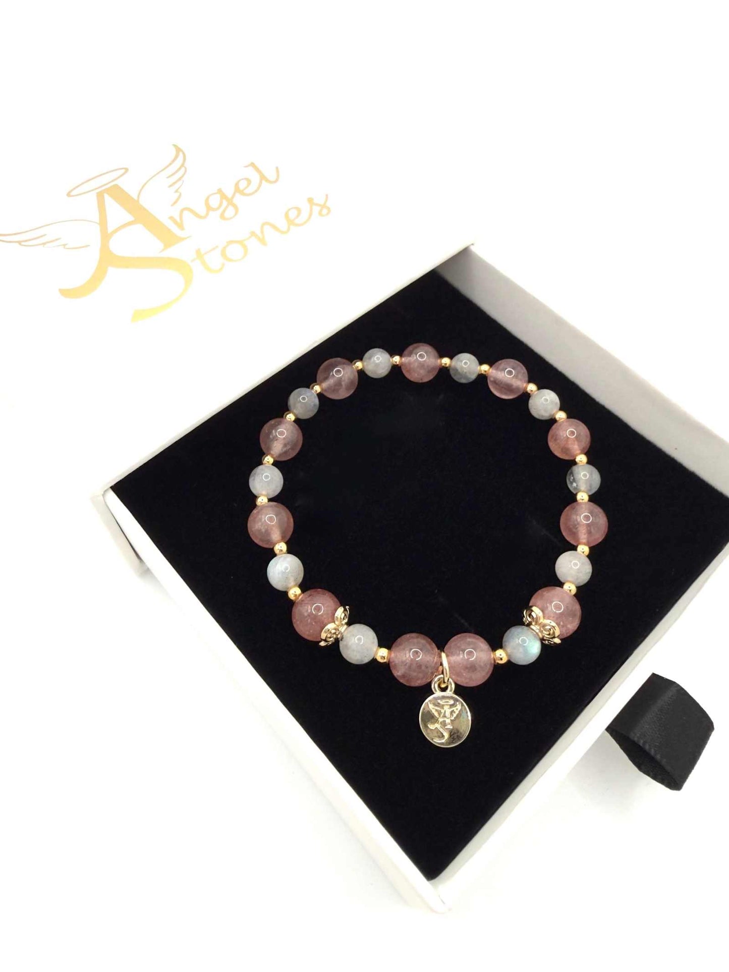 Love Compassion Bracelet with Strawberry Quartz, Labradorite, and heart charm on a white background