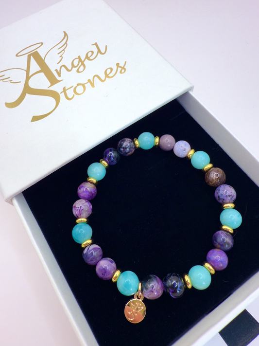 Transformation Bracelet with Amazonite, Charoite, and Sugilite beads in a white Angel Stones box