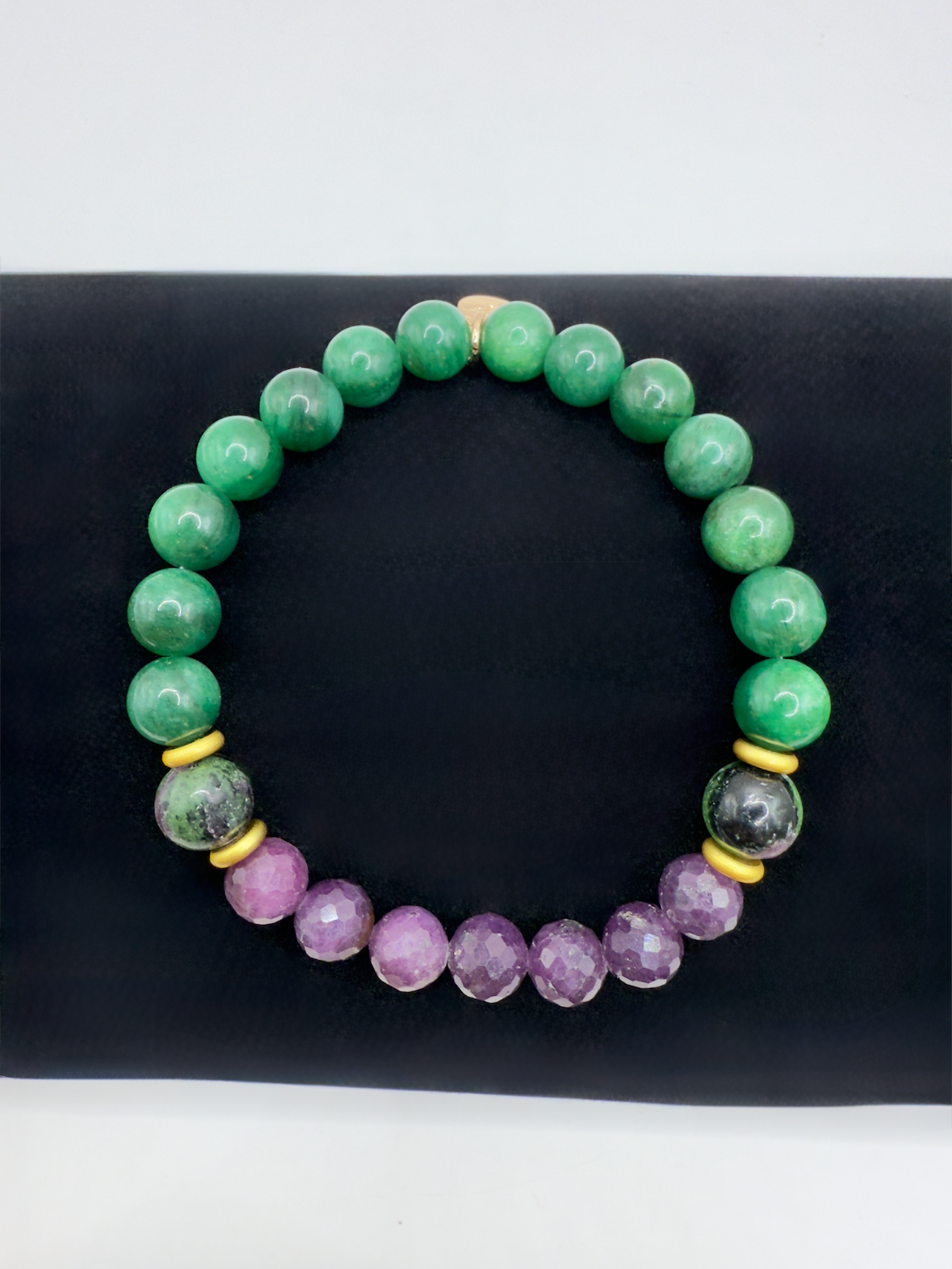 Wicked Bracelets Elphaba edition with emerald, ruby, and zoisite beads on black background