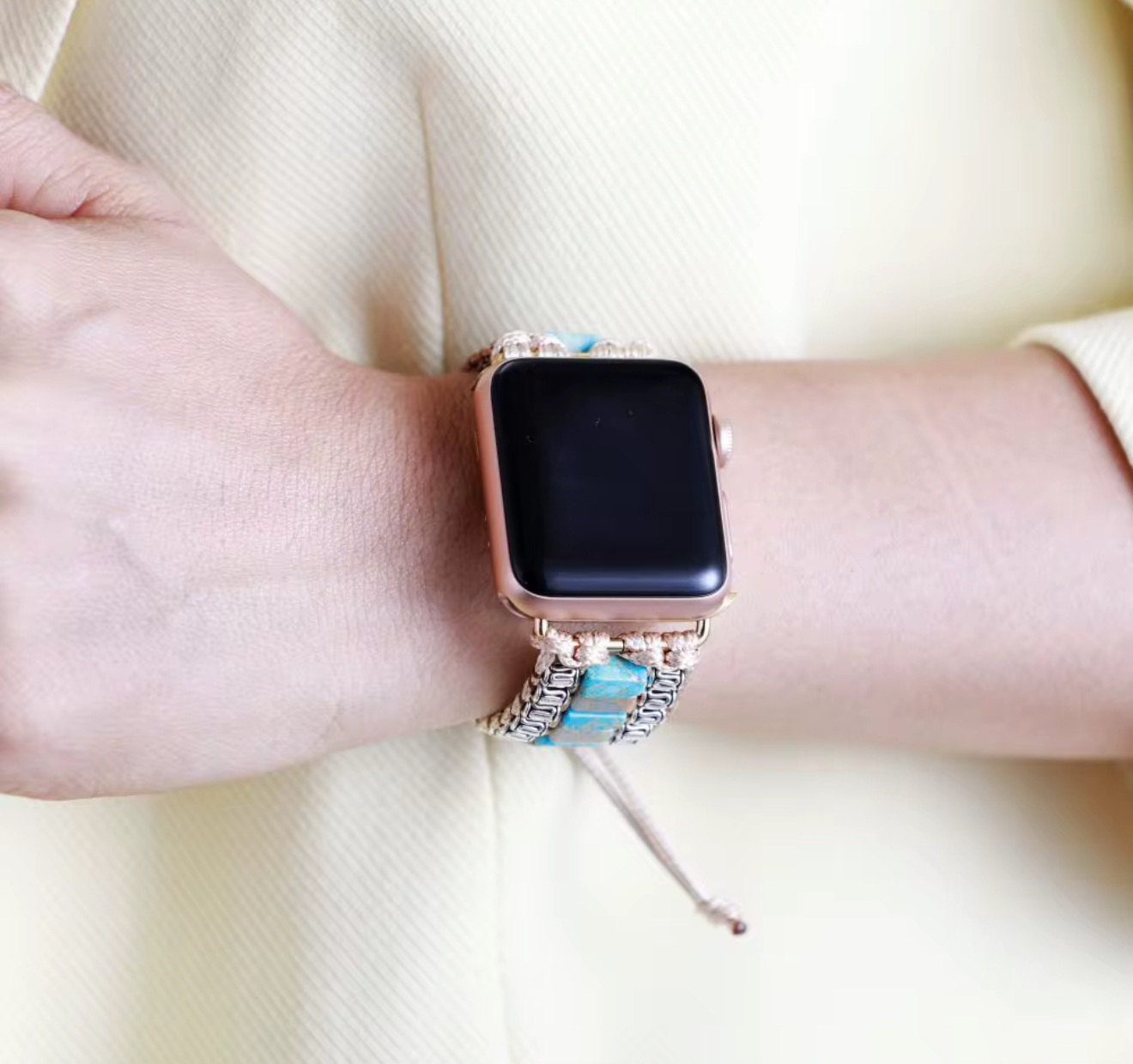 Desert Tide Apple Watch Band with turquoise stone tiles, beige handwoven cord, and antique silver accents on wrist