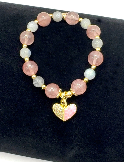 Love Compassion Bracelet with Strawberry Quartz, Labradorite, and pink heart charm on wrist