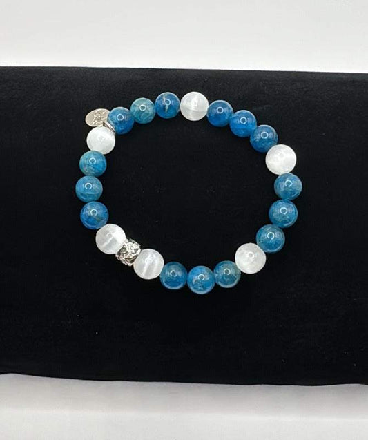 Manifestation Bracelet with blue apatite and white selenite beads on black background