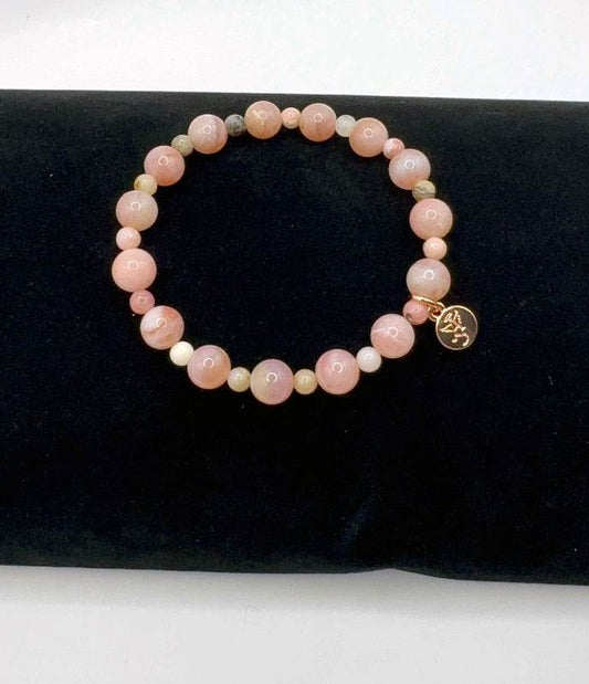 Romantic Love Bracelet with pink opal beads symbolizing love and tenderness on black background