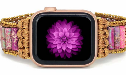 Violet Meadow Apple Watch Band with handwoven natural cord, purple and pink stone beads, gold-toned accents, and silver floral slide clasp.