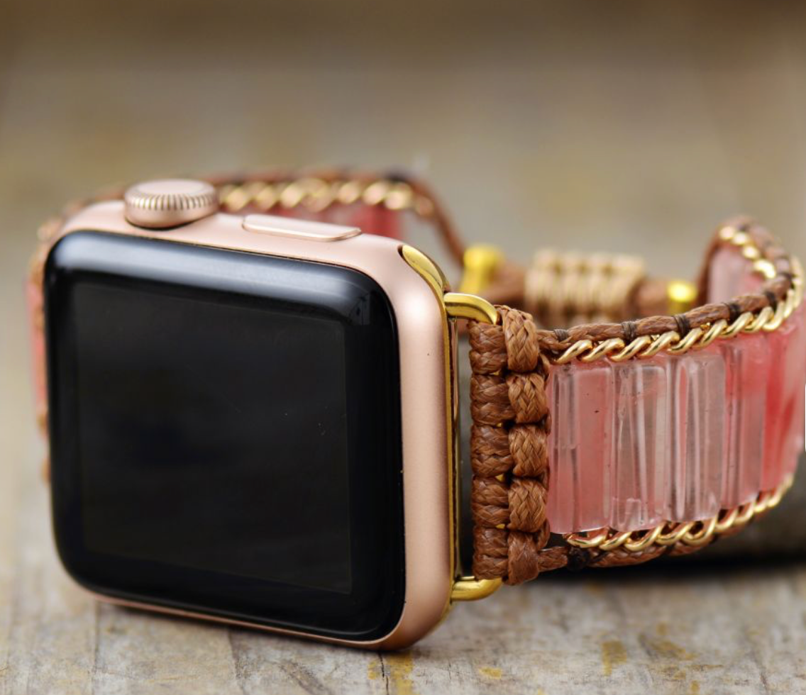 Peach Crystal Apple Watch Band with faceted peach crystals, beige macramé cord, and gold-tone accents on a gold Apple Watch.